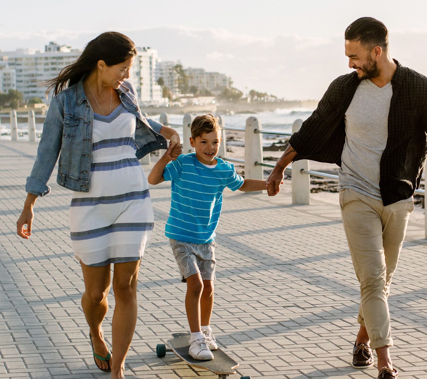 A young family walking the boardwalk, from the carrier’s own materials